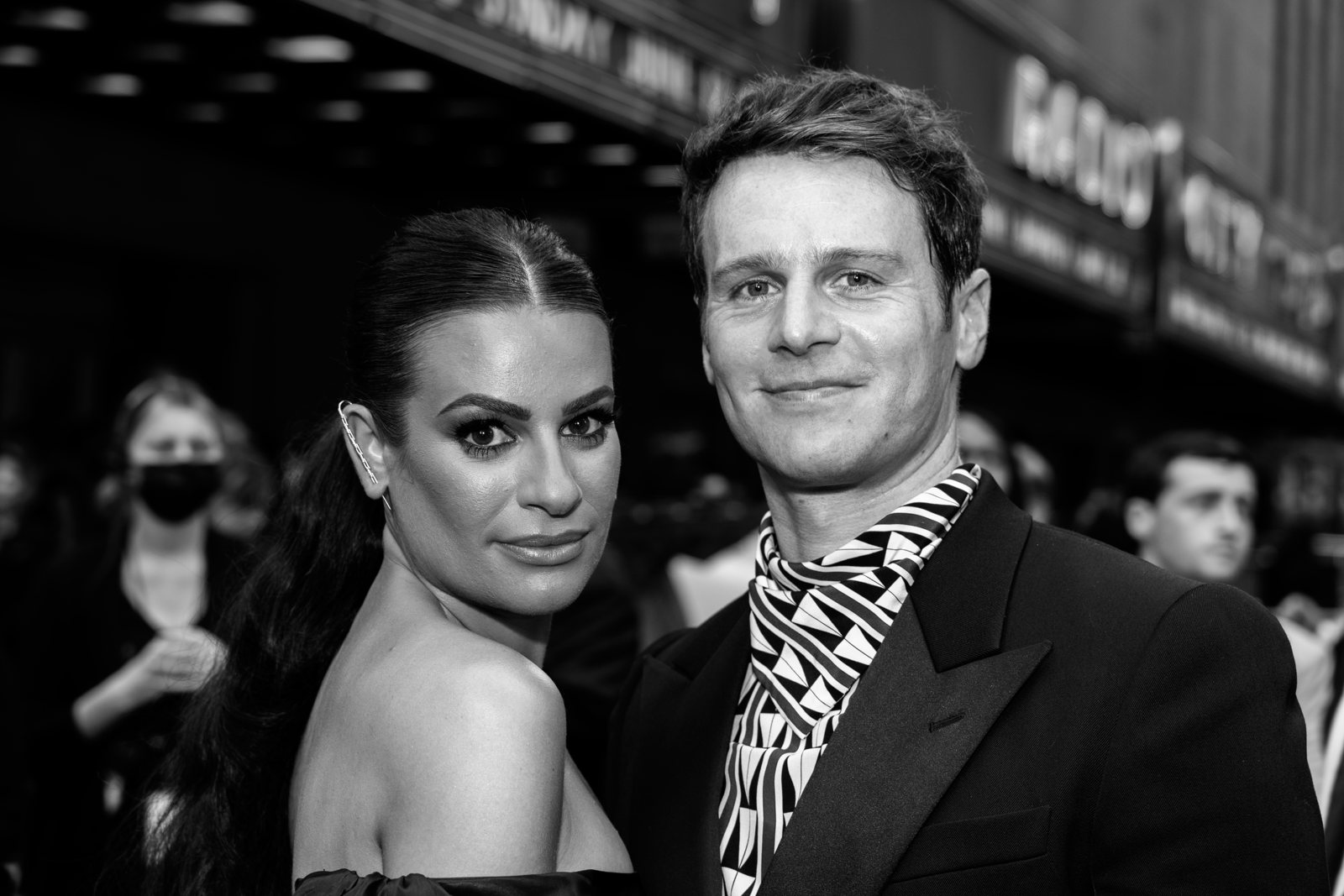 Black and white red carpet portrait of two guests at the Tony Awards